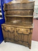 20th cent. Dark oak dresser and rack, the top with two shelves, the base with two drawers above