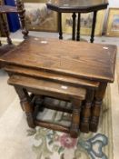 20th cent. Oak nest of three tables with turned legs and cross stretchers. Largest 18¾ins. x 24ins.