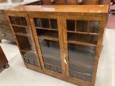 Art Deco: 1930s walnut dwarf three door display cabinet of elegant form. 12ins. x 48ins. x 42ins.
