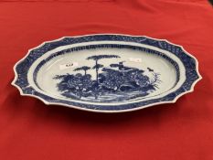 Oval serpentine dish with chrysanthemums and auspicious symbols.