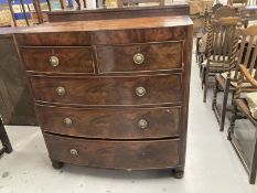 Early 19th cent. Mahogany bow front chest of two over three drawers with a cross banded top, round