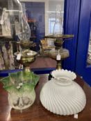 Victorian oil lamps black ceramic bases, brass columns, one with damage, one with glass reservoir