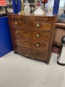 Early 19th cent. Mahogany bow front chest of two over three drawers with a cross banded top, round