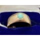 Jewellery: Yellow metal ring in the form of a tapering band set with an oval cabouchon cut turquoise - Image 1 of 3