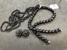 19th cent. Black glass jewellery, necklaces one with matching earrings. 18ins. and 40ins.