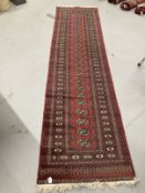 Carpets & rugs: 20th cent. North African runner in the style of a Turkman, red ground central