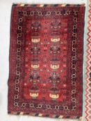 Carpets & Rugs: Early 20th cent. Indian carpet with multicoloured ground of reds, oranges, greys,