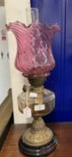 Victorian oil lamp black ceramic base, brass column, clear glass reservoir and pink glass shade,