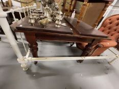 19th cent. Mahogany extending dining table on turned supports with castors, two inserts. Closed