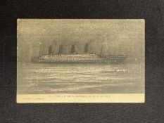 R.M.S. TITANIC: Rare French postcard showing her at night in Cherbourg, all lights on, with pink