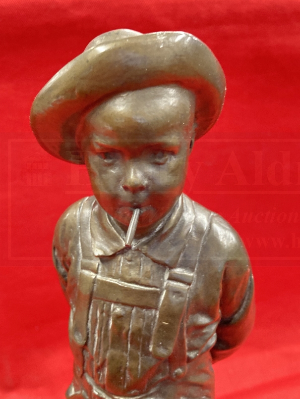 C. Kundonmann: Bronze figure of a boy smoking a Cheroot raised on a black marble base, signed C. - Image 2 of 4