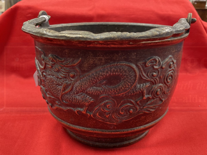 Early 20th cent. Chinese bronze rice pot depicting a dragon on both sides and a shaped handle. 6ins. - Image 3 of 4