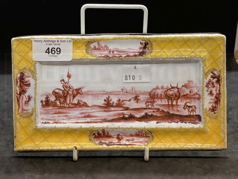 Collectables: 19th cent. Enamel pen rest painted in puce monochrome with cattle in a stream, the