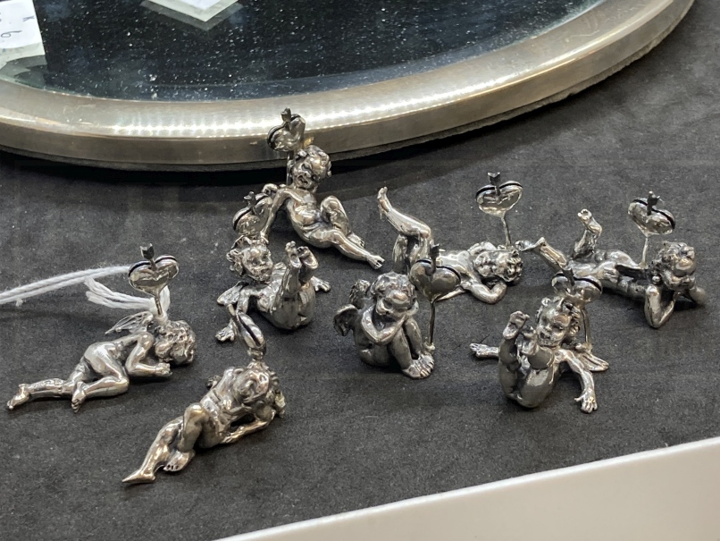 Hallmarked Silver: Oval mirror 9½ins. x 6½ins. Plus eight place name holders in the form of cherubs. - Image 3 of 4