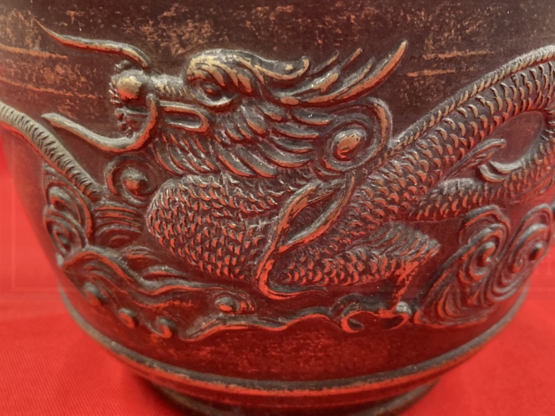 Early 20th cent. Chinese bronze rice pot depicting a dragon on both sides and a shaped handle. 6ins. - Image 2 of 4