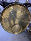 Islamic Metalware: Large round brass tray with crimpled edge engraved with Islamic script. 32½ins.
