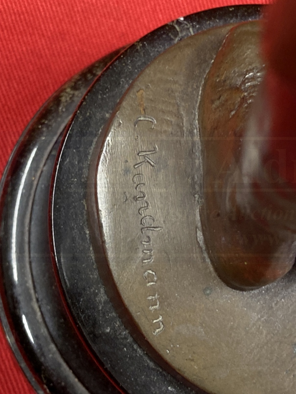 C. Kundonmann: Bronze figure of a boy smoking a Cheroot raised on a black marble base, signed C. - Image 4 of 4