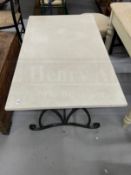 Gardenalia: Wrought iron table base with composite top. 50ins. x 28ins.