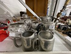 Early 20th cent. White metal embossed three piece tea set plus Civic Pewter four piece tea set.