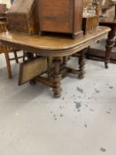 19th cent. Oak extending table with vase shaped turned supports, a cross stretcher with three fluted