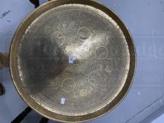 Indian carved table with octagonal top carved with border of flowers, central panel of warrior