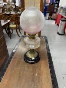 Oil lamp, Sharwoods Ltd etched shade, cut glass reservoir, brass column on a black ceramic base.
