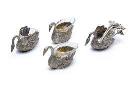 A SET OF FOUR GERMAN SILVER SWAN SALT CELLARS AND SPOONS
