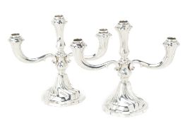 A PAIR OF GERMAN SILVER THREE LIGHT CANDELABRA
