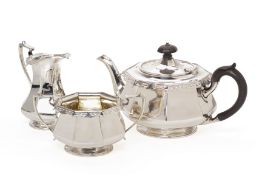 A SILVER THREE PIECE TEA SERVICE