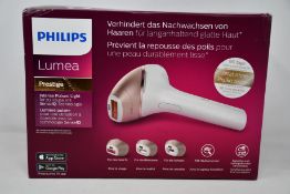 A boxed as new Philips Lumea Prestige hair removal device.