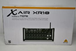 A Behringer Midas XR18 digital mixing desk.