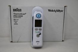 A boxed as new Welch Allyn Braun ThermoScan PRO 6000 ear thermometer with cradle.
