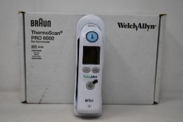 A boxed as new Welch Allyn Braun ThermoScan PRO 6000 ear thermometer with cradle.