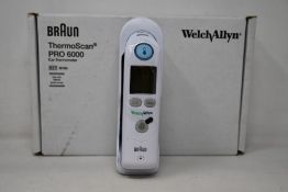 A boxed as new Welch Allyn Braun ThermoScan PRO 6000 ear thermometer with cradle.