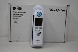 A boxed as new Welch Allyn Braun ThermoScan PRO 6000 ear thermometer with cradle.