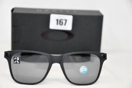 A pair of as new Oakley Apparition sunglasses Satin Black frame with Black iridium Polarized