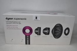A boxed as new Dyson Supersonic hairdryer.