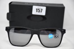 A pair of as new Oakley Apparition sunglasses Satin Black frame with Black iridium Polarized