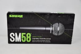An as new Shure SM58 legendary vocal microphone.
