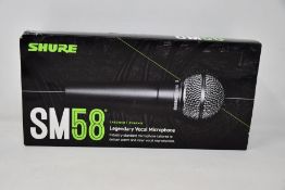 An as new Shure SM58 legendary vocal microphone.