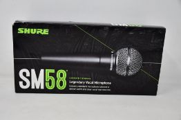 An as new Shure SM58 legendary vocal microphone.