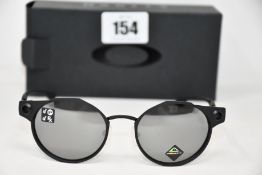 A pair of as new Oakley Deadbolt sunglasses Satin Black frame with Prizm Black Polarized lenses (
