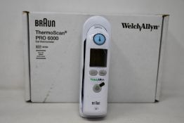 A boxed as new Welch Allyn Braun ThermoScan PRO 6000 ear thermometer with cradle.