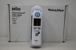 A boxed as new Welch Allyn Braun ThermoScan PRO 6000 ear thermometer with cradle.
