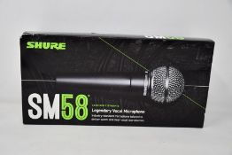 An as new Shure SM58 legendary vocal microphone.