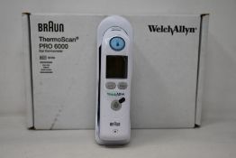 A boxed as new Welch Allyn Braun ThermoScan PRO 6000 ear thermometer with cradle.