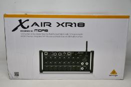 A Behringer Midas XR18 digital mixing desk.