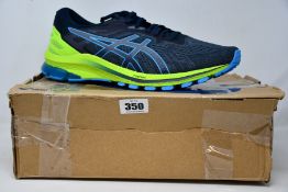 A pair of men's as new Asics GT-1000 10 trainers (UK 11.5).