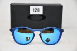 A pair of as new Oakley Pitchman R glasses matte translucent blue frame with Prizm Sapphire