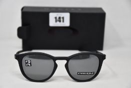 A pair of as new Oakley Pitchman R glasses Satin Black frame with Prizm Black Polarized lenses (